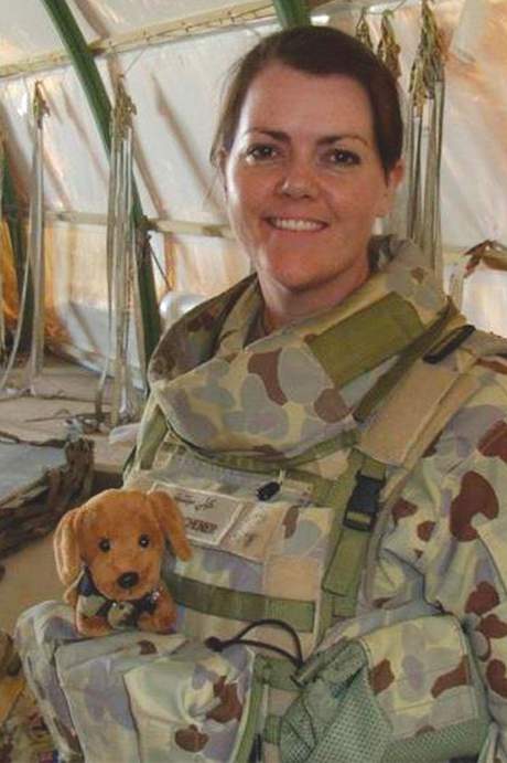 Flt Lt Kelli Mitchener with Austin the combat dog getting ready to fly home, October 2018. Reproduced with permission of Flt Lt Leigh Stalling
