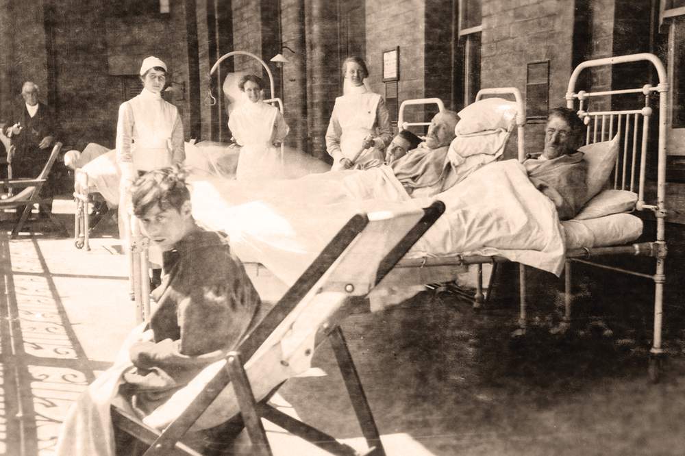 Photo: Patients and Nurse Kelly, Nurse Fraser and Sister Marshall, balcony ward 11, Melbourne Hospital, circa 1919. From the Alice E. Broadhurst Collection, courtesy of the Yarra Plenty Regional Library