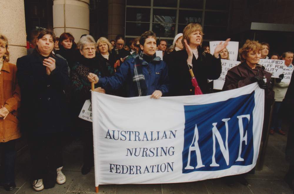 Aged care nurses outside the Department of Health & Aged Care in 2001 rallying for safe staffing. Photo: Mark Munro.